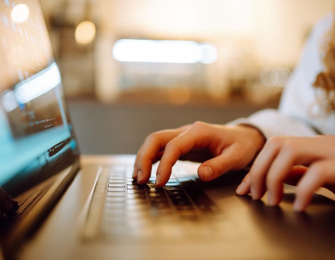 Hands typing On Laptop