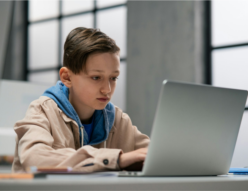 a child working on a laptop with cybersecurity for schools pittsburgh